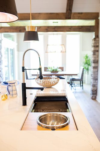 A kitchen with a sink and a counter top